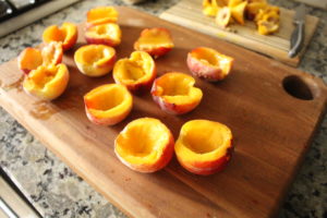 Halved and pitted peaches