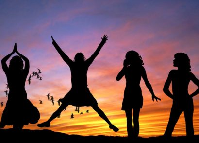 Silhouette of four women against the sunset
