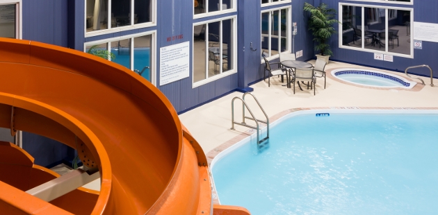 Orange waterslide over the pool at Radisson Hotel & Suites - Fort McMurray