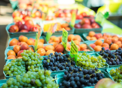Grapes, peaches, and other fruit at a farmer's market