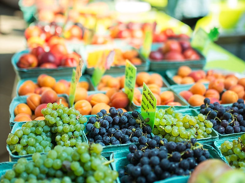 Grapes, peaches, and other fruit at a farmer's market