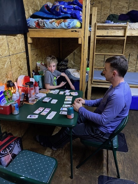 Playing cards inside the ice fishing cabin on Gull Lake with Adventure Ice Fishing