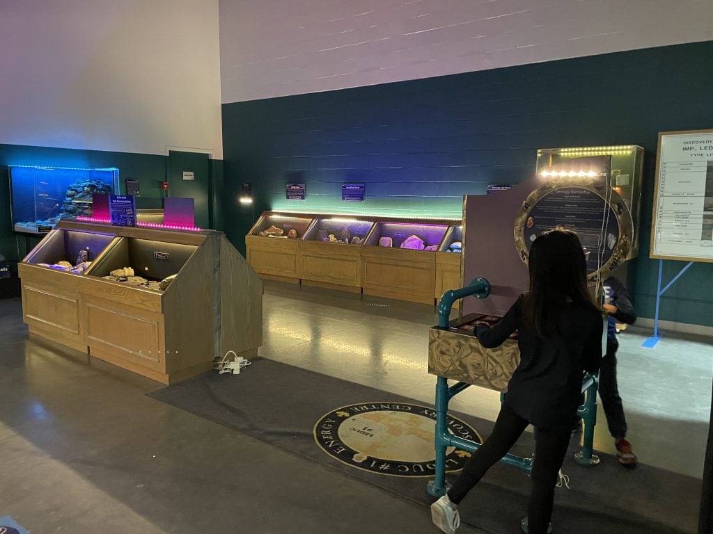 Geology room with kids playing rock battleship at Canadian Energy Museum